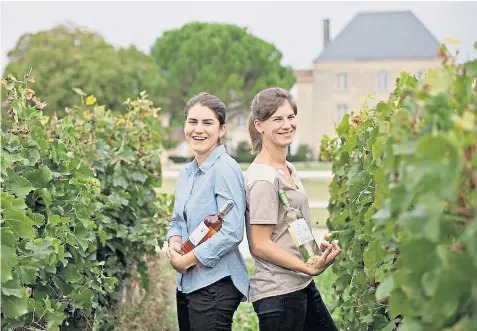  ?? ?? Marie-caroline Rozier and sister, Anne-cecile, in more prosperous times. Chateau des Arras, in Bordeaux is uprooting its vines, below