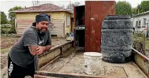  ?? ?? Left: John Morrell says restoring the family home is down to him in the absence of insurance. Above: Justin Naaka had to make his own house and contents calls.