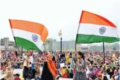  ?? — PTI ?? Members of the Muslim community wave tricolours during a protest rally in Doranda block of Ranchi.