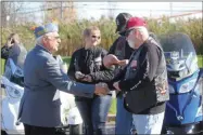  ?? CHARLES PRITCHARD - ONEIDA DAILY DISPATCH ?? Sons of the American Legion Detachment Commander Dennis George shakes hands with local veterans on Tuesday, Oct. 29, 2019.