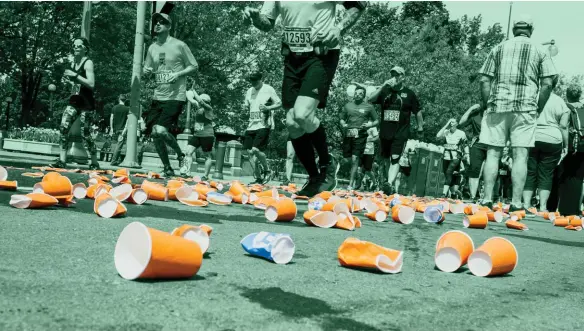  ??  ?? ABOVE An aid station at the Ottawa Marathon shows the amount of waste created. Cups were later cleaned up and recycled by the race staff. RIGHT Jasmine (left) and Jett (right), founders of the Kids’ Run for Nature BOTTOM Kids’ Run For Nature