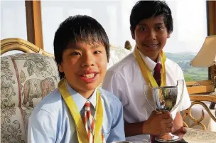  ??  ?? ●● Joss Abbs-Brown (left) and Isaac Abbs-Brown with their winners’ trophies from the Buxton Drama Festival