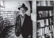  ?? (The New York Times file photo) ?? Lawrence Ferlinghet­ti stands in City Lights bookstore in San Francisco in July 1993. “Poetry must be capable of answering the challenge of apocalypti­c times, even if this means sounding apocalypti­c,” he said in a 2013 Interview magazine article.