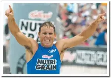  ?? Picture: GETTY ?? Dean Mercer celebrates victory as hecrosses the finish line at Main Beach in 2003.