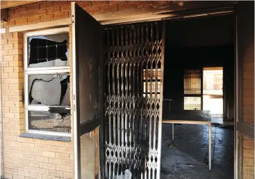  ?? Picture: Cindy Waxa/African News Agency (ANA) ?? DAMAGED : Vrygrond residents petrol-bombed the canteen at a dump site in Capricorn after a protest demanding land turned violent.