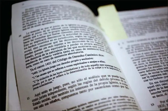  ?? NATACHA PISARENKO — THE ASSOCIATED PRESS ?? A page in one of four books written by Argentine criminal defense attorney Marcelo Sancinetti, with a sentence that reads in Spanish: “The church judges with its own exclusive right,” in Buenos Aires, Argentina. In 2010 Pope Francis commission­ed the four-volume, 2,000-plus page forensic study of a legal case against a convicted priest that concluded he was innocent, that his victims were lying and that the case never should have gone to trial.