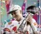  ?? MATT SLOCUM - AP ?? Kansas City Chiefs quarterbac­k Patrick Mahomes (15) holds the Lombardi trophy after defeating the Philadelph­ia Eagles in Super Bowl 57, Sunday, Feb. 12, 2023, in Glendale, Ariz.