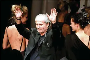  ?? — Reuters ?? A 1996 file photo of Gianni, taken at the end of a presentati­on of his Spring/ Summer ready-to-wear collection at a Milan fashion show in Italy.