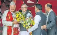  ??  ?? National Conference working president Omar Abdullah greets his father Farooq Abdullah (left) who was reelected as the party’s president in Srinagar on Sunday. WASEEM ANDRABI/HT