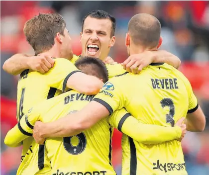  ?? Photo / Getty Images ?? Steven Taylor and the Phoenix came back from a goal down to beat Adelaide.