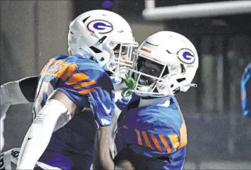  ?? Lindsey Smith Special to the Review Journal ?? Bishop Gorman’s Jonathan Brady, right, celebrates with a teammate after a TD in the Gaels’ playoff victory over Foothill on Friday at Bishop Gorman High School.