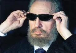  ??  ?? This file photo taken on Nov 16, 1999 shows Castro trying on a pair of sunglasses as he talks to the media in Havana during the IX Iberoameri­can Summit.