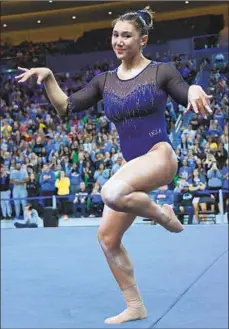  ?? Jayne Kamin-Oncea Getty Images ?? OLYMPIC GOLD MEDALIST Kyla Ross, performing on the f loor against Arizona, says college gymnastics is “very interactiv­e.”