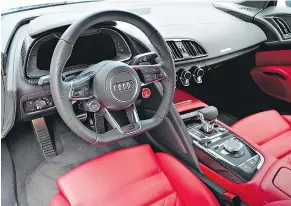  ??  ?? The R8’s cockpit is designed with the driver in mind and the stitching, materials and build quality are fantastic.