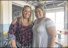  ?? JILL VEJNOSKA / AJC ?? Tamara Stevens (left), a Roswell mother of three, and Essence Johnson, an East Cobb mother of a 4-year-old who’s thinking of running for office herself, meet to figure out ways to coordinate their efforts.