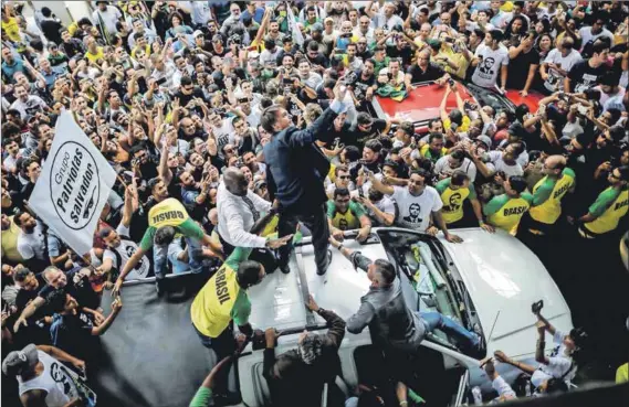  ??  ?? Fascist threat: Former army captain Jair Bolsonaro (above), who stands for the militarisa­tion of the state combined with extreme free-market policies, will be up against the Workers’ Party presidenti­al candidate, Fernando Haddad (left), in Brazil’s election this Sunday. Photo: Ueslei Marcelino/Reuters and Pilar Olivares/Reuters