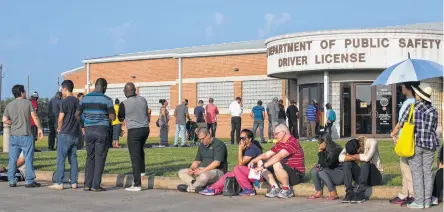  ?? Godofredo A. Vasquez / Houston Chronicle ?? A line forms Monday before the 8 a.m. opening of the Gessner Mega Center, where operating hours have been recently cut back.