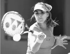  ??  ?? Belinda Bencic of Switzerlan­d returns a shot against Magdalena Rybarikova of Slovakia during the BNP Paribas Open at the Indian Wells Tennis Garden at Indian Wells Tennis Garden in Indian Wells, California in this March 12, 2016 file photo. — AFP photo