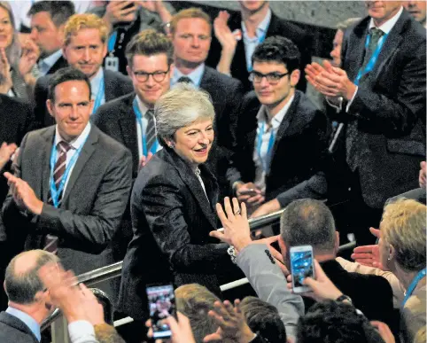  ?? Pictures: GETTY, REUTERS ?? Theresa May greets supporters yesterday after she made her keynote speech to the Tory party conference in Birmingham