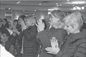 ?? JEREMY FRASER/CAPE BRETON POST ?? Members of the Cape Breton community are shown clapping their hands following a passionate speech from teacher Neeta Kumar-Britton during a public forum put on by the Nova Scotia Teachers Union on Thursday.