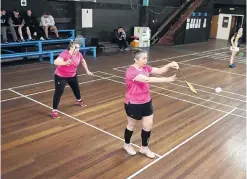  ?? ?? Pairing up . . . Dunedin badminton identity Andrea Vernall (left) is poised as Anna Ritchie, of Canterbury, serves during a women’s doubles plate match.