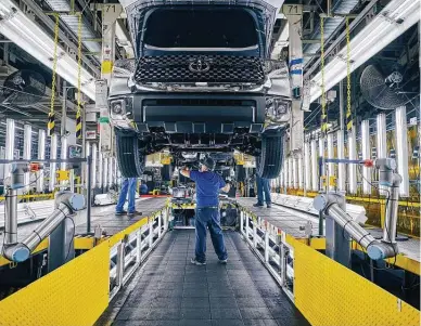  ?? Toyota Texas / Tribune News Service file photo ?? Toyota employees work at the plant in San Antonio. A petrochemi­cals shortage is affecting the company’s production of sedans and an SUV in Kentucky, engines in West Virginia and pickups in Mexico.