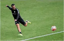  ?? PHOTOSPORT ?? Shane Smeltz rounds goalkeeper Tamati Williams during an All Whites training session this week. Right, Clayton Lewis takes a shot at training.