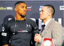  ?? Picture / Getty Images ?? NZ heavyweigh­t Joseph Parker (right) fronts up to Anthony Joshua during their media conference in London yesterday.