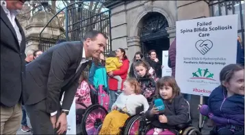  ?? ?? Wicklow Sinn Féin TD John Brady meets with children with scoliosis outside Leinster House prior to Sinn Féin motion last week.