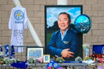  ?? Photo: Mike Egerton/PA Wire ?? TRIBUTE: Leicester City fans pay tribute to the club’s popular owner Vichai Srivaddhan­aprabha, who died in last weekend’s helicopter crash.