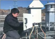  ?? XIN WEN / CHINA DAILY ?? An engineer checks equipment at the China Regional Atmosphere Watch Station in Beijing.