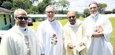  ?? ?? Monsignor Gregory Ramkissoon, (second right) with from left: Father Xavier Kannickarr­y, Father Peter McIsaac and Reverend Charles Dufour at his 70th birthday anniversar­y mass of thanksgivi­ng at Sacred Hearts of Jesus and Mary Chapel Jacob’s Ladder in Moneague, St Ann on May 4.