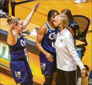  ?? STEPHEN SPILLMAN/ASSOCIATED PRESS ?? Tech coach Nell Fortner (right) celebrates Tuesday’s 73-56 tournament win over West Virginia with her players. “I missed teaching the game and encouragin­g kids. These are some physically gifted, bright young women, and you want to help send them out into the world in the best possible way,” she said.