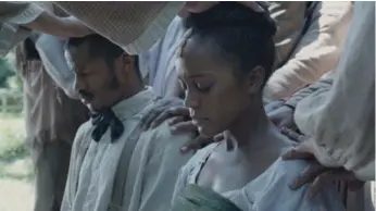  ?? COURTESY OF TIFF ?? Nate Parker, Aja Naomi King are seen in The Birth of A Nation. TIFF stands by its plan to screen the film three times, despite rape allegation­s from director Parker’s past that have turned a negative spotlight on the film.