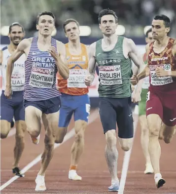  ?? ?? Jake Wightman battles his way to second place in his 800m semi-final to stay in the medal hunt