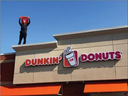  ?? SUBMITTED PHOTO ?? Onondaga County Sheriff’s Office Lt. Christophe­r Koeppe stands on the roof of the Dunkin’ restaurant on Manlius Center Road in East Syracuse, N.Y., on Friday, Aug. 2. Local law enforcemen­t officials were on the roof of more than 35Dunkin’ locations to help raise awareness and funds for Special Olympics NewYork. All contributi­ons generated from the campaign support Special Olympics NewYork programs for Central New York families. The charitable initiative has generated more than $332,000since its inception in 2012.