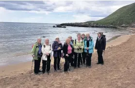  ??  ?? Life’s a beach Members follow their route by the sea