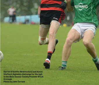  ??  ?? Darren O’Keeffe (Newmarket) and Aaron Stafford (Aghada) challenge for the ball in the Bons Secour County Premier IFC at Grenagh
Photo byJohn Tarrant