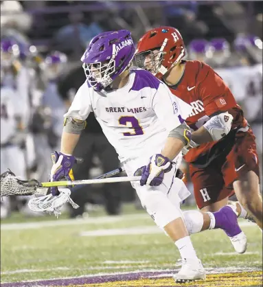  ?? Hans Pennink / Albany Times Union ?? Albany’s T.D. Ierlan (3), the top faceoff man in the country, is transferri­ng to Yale this fall and will be eligible immediatel­y.