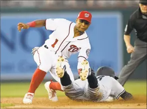  ?? Nick Wass / Associated Press ?? New York Yankees’ Didi Gregorius is tagged out by Washington Nationals second baseman Wilmer Difo as he tried to steal second during the fifth inning Monday in Washington.