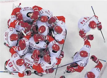  ??  ?? Olympic Athletes from Russia celebrate their win in the men’s semi-final ice hockey match against the Czech Republic.