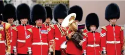  ?? ?? If the cap fits: Changing the Guard at Buckingham Palace