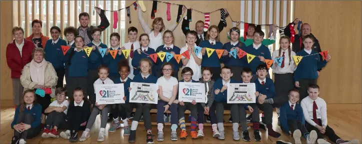  ??  ?? Darragh Jordan with his 5th class colleagues and family at World Down Syndrome Day 2019 in St. Aidan’s Primary School.