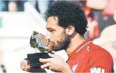  ?? — AFP photo ?? Liverpool’s Mohamed Salah celebrates after being awarded the Golden Boot award.