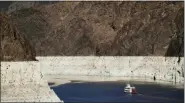  ?? JAE C. HONG — THE ASSOCIATED PRESS FILE ?? A riverboat glides through Lake Mead on the Colorado River at Hoover Dam near Boulder City, Nev.