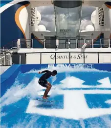  ?? — MING TEOH/ The star ?? malaysian celebrity surfer alfian affandi on the Flowrider surf simulator on board royal caribbean’s Quantum of the seas.
In the background is ripcord by ifly, an indoor skydiving facility.