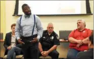  ?? CHRISTINE WOLKIN — FOR DIGITAL FIRST MEDIA ?? Anwar Muhammad, owner of The Black Reserve Bookstore, addresses fellow community members during Lansdale’s Community Forum on Racism at Lansdale’s Borough Hall Saturday, May 12, 2018. The event was organized by Muhammad.