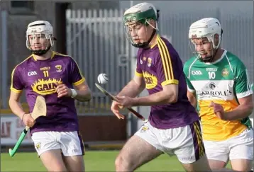  ??  ?? Gary Molloy bursts upfield out of reach of Offaly attacker Conor Freeman.