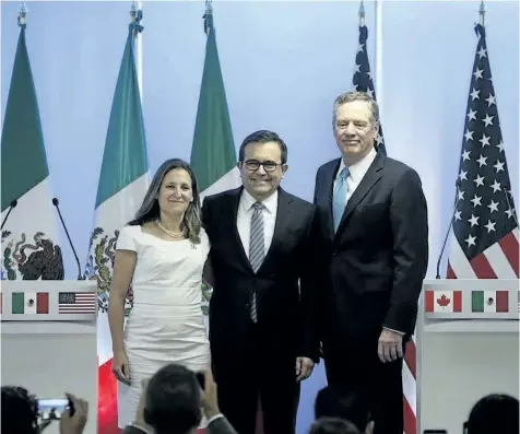  ?? MARCO UGARTE/THE CANADIAN PRESS ?? Canadian Foreign Affairs Minister Chrystia Freeland, from left, Mexico’s Secretary of Economy Ildefonso Guajardo Villarreal, and U.S. Trade Representa­tive Robert Lighthizer, pose for a group photo at a press conference regarding the second round of...
