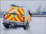  ??  ?? Courtown/Arklow Coast Guard Unit driving through snow drifts.